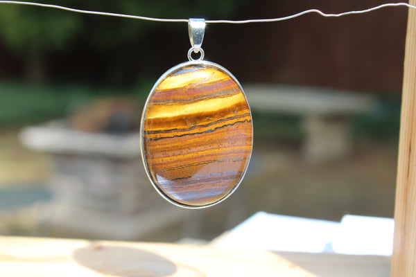 Large Oval Tiger's Eye Pendant - Amazon Imports, Inc. - Fine Quality Gemstones and Jewelry Since 1978