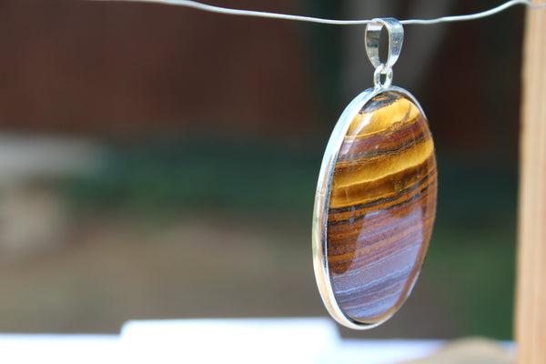 Large Oval Tiger's Eye Pendant - Amazon Imports, Inc. - Fine Quality Gemstones and Jewelry Since 1978