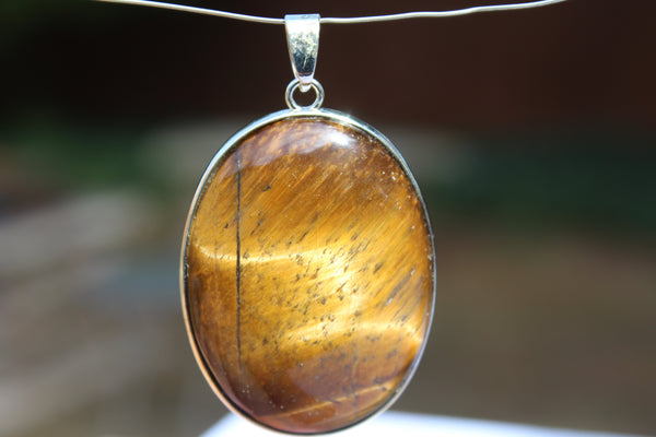Large Oval Tiger's Eye Pendant - Amazon Imports, Inc. - Fine Quality Gemstones and Jewelry Since 1978